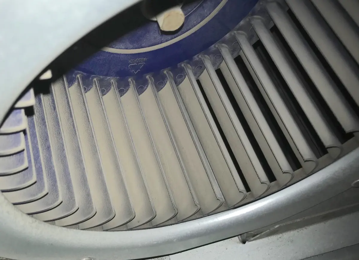 Blower wheel packed with grey dust