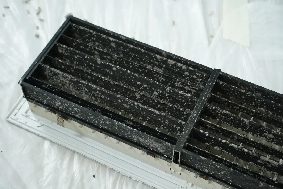 Return grille caked with dust