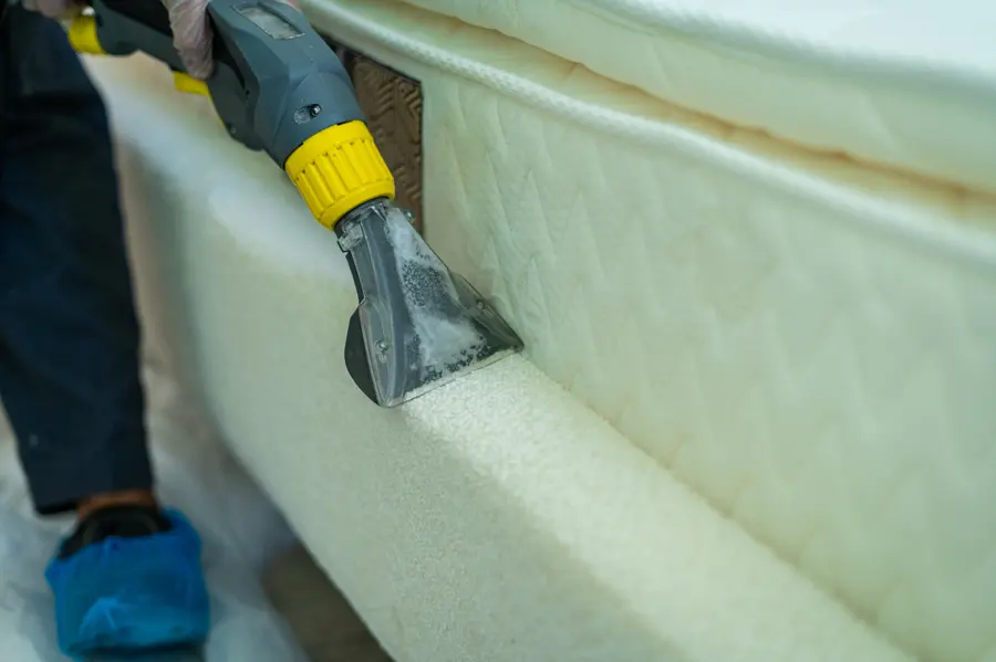 An extraction tool worked across the surface of a mattress