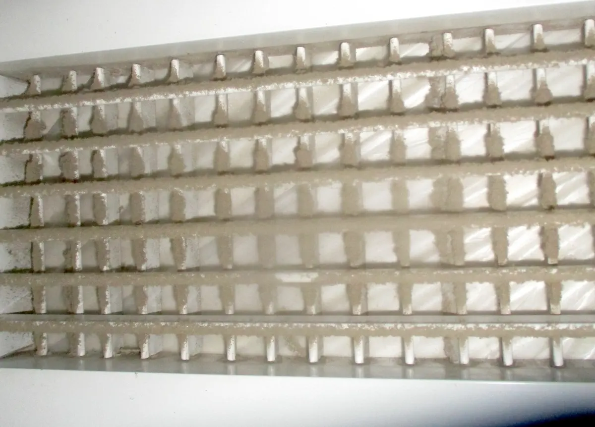 Return grille caked with grey dust before cleaning